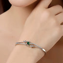 Rhodium Plated Silver Toned  Green Oval American Diamond Studded Cuff Bracelet