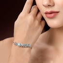 Rhodium Plated Silver Toned White Flower & Mint Green Teardrop American Diamond Studded Wraparound Adjustable Bracelet