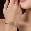 Rhodium Plated Silver Toned Blue Teardrop American Diamond Studded Cuff Bracelet