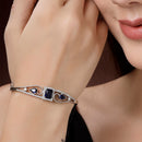 Rhodium Plated Silver Toned Blue Square & Teardrop American Diamond Studded Cuff Bracelet