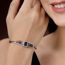 Rhodium Plated Silver Toned Blue Square & Teardrop American Diamond Studded Cuff Bracelet
