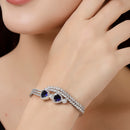 Rhodium Plated Silver Toned Blue Teardrop American Diamond Studded Cuff Bracelet
