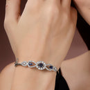 Rhodium Plated Silver Toned Oval & Teardrop Blue American Diamond Studded Cuff Bracelet