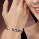 Rhodium Plated Silver Toned Oval & Teardrop Blue American Diamond Studded Cuff Bracelet