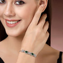 Rhodium Plated Silver Toned White Flower & Green Teardrop AD Studded Wraparound Adjustable Bracelet