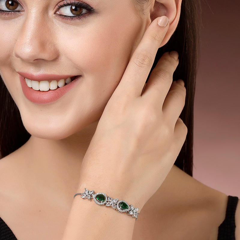 Rhodium Plated Silver Toned White Flower & Green Teardrop AD Studded Wraparound Adjustable Bracelet