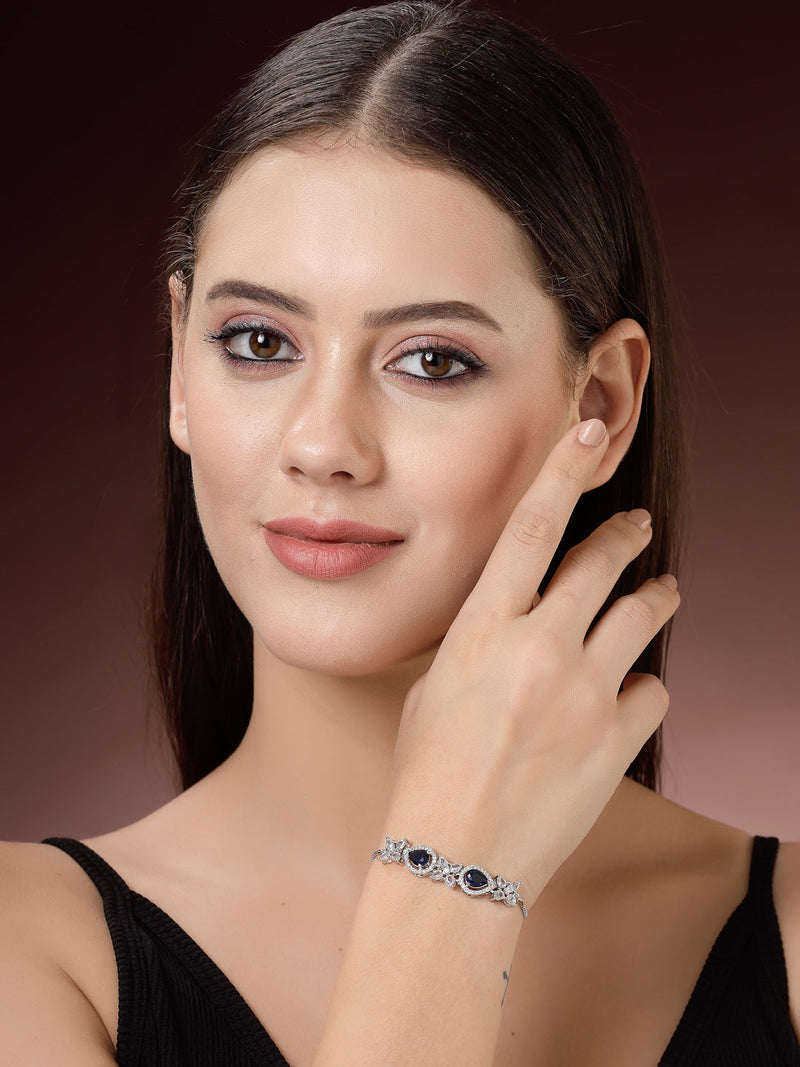 Rhodium Plated Silver Toned White Flower & Blue Teardrop American Diamond Studded Wraparound Adjustable Bracelet