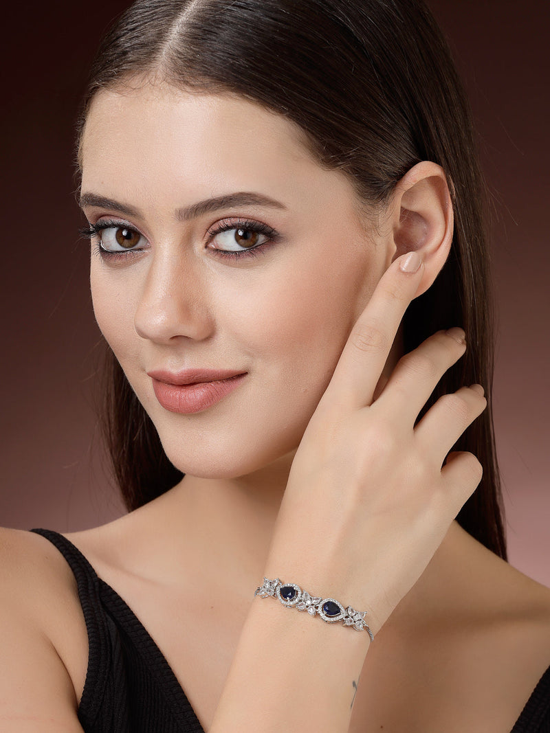 Rhodium Plated Silver Toned White Flower & Blue Teardrop American Diamond Studded Wraparound Adjustable Bracelet