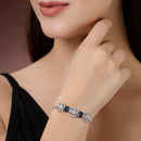 Rhodium Plated Silver Toned White Round & Blue Rectangle American Diamond Wraparound Adjustable Bracelet