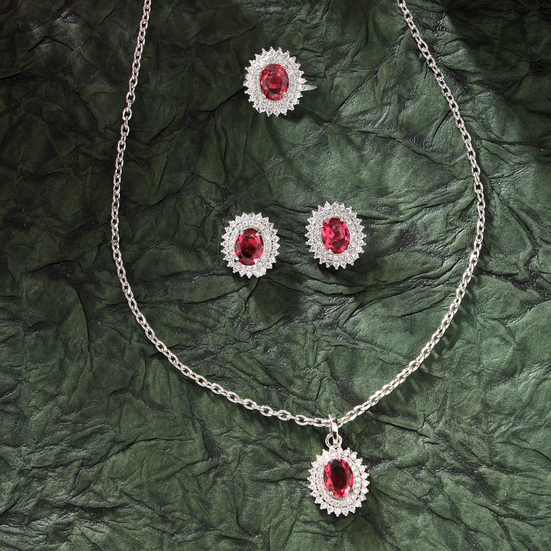 Rhodium Plated Silver Toned Oval Shaped Ruby Red American Diamond Studded Pendant Combo With Ring