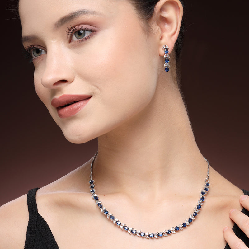 Rhodium Plated Silver Toned Teardrop Shaped Blue & White American Diamond Studded Jewellery Set