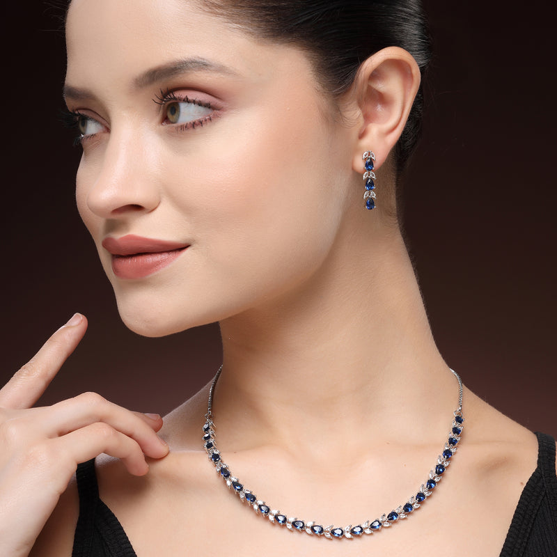 Rhodium Plated Silver Toned Teardrop Shaped Blue & White American Diamond Studded Jewellery Set