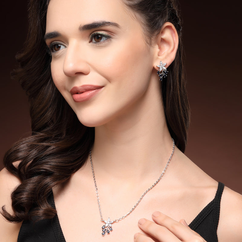 Rhodium Plated Silver Toned Blue And White American Diamond Studded Floral Teardrop Shaped Pendant Set