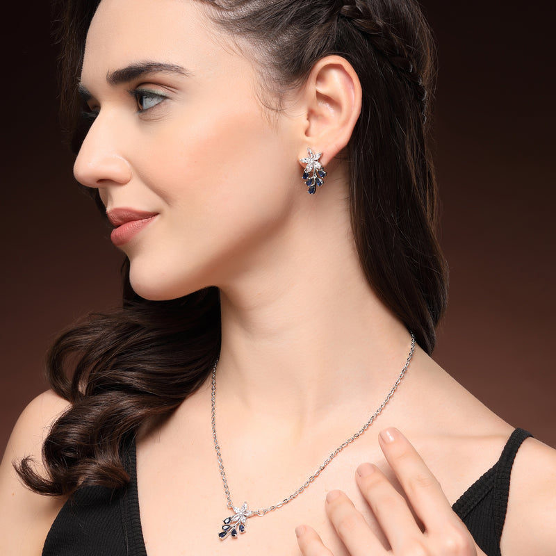 Rhodium Plated Silver Toned Blue And White American Diamond Studded Floral Teardrop Shaped Pendant Set