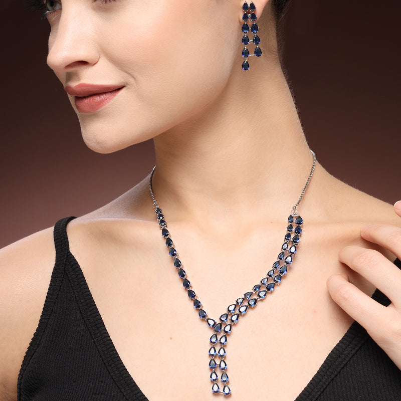 Rhodium Plated Silver Toned Teardrop Shaped Blue American Diamond Studded Jewellery Set