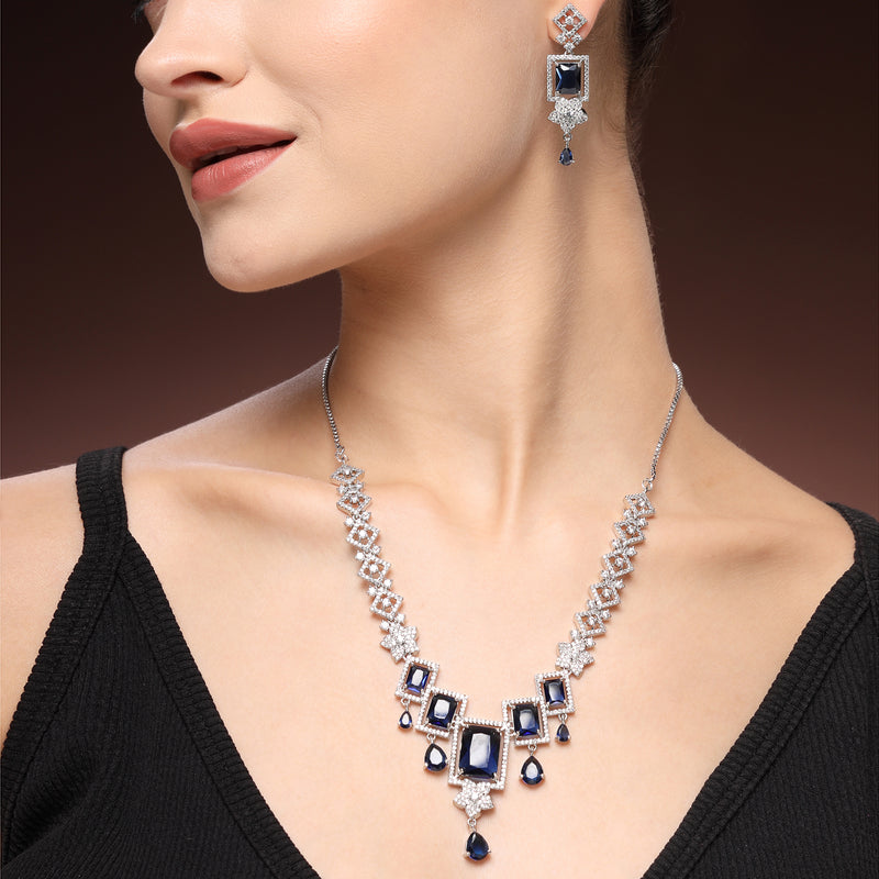 Rhodium Plated Silver Toned Rectangular Shaped Navy Blue & White American Diamond Studded Necklace With Earrings Jewellery Set
