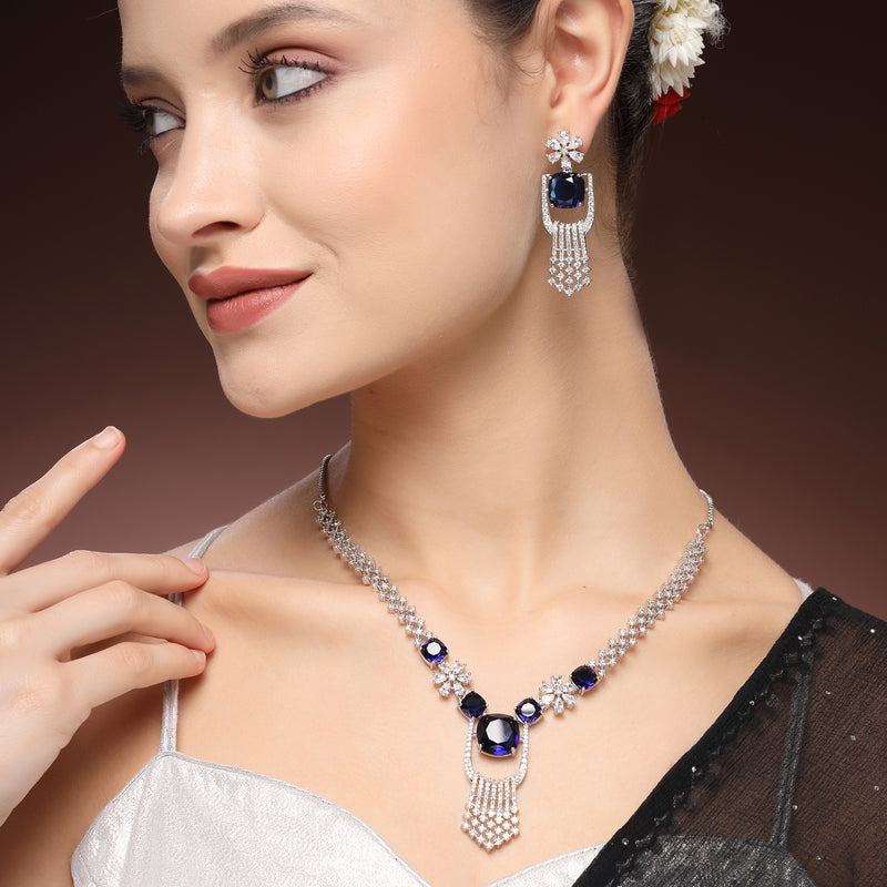 Rhodium Plated Silver Toned Floral Shaped Blue & White American Diamond Studded Jewellery Set