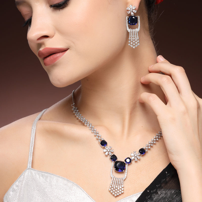 Rhodium Plated Silver Toned Floral Shaped Blue & White American Diamond Studded Jewellery Set