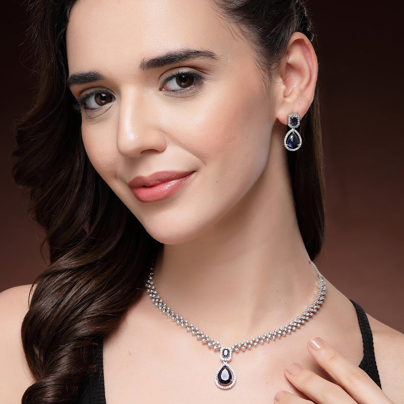 Rhodium Plated Silver Toned Teardrop Shaped Blue & White American Diamond Studded Jewellery Set