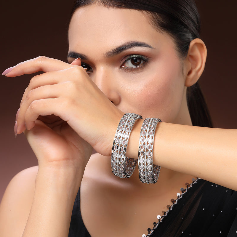 Rhodium Plated Silver Toned Oval Shaped American Diamond Studded Bangles Set Of 2
