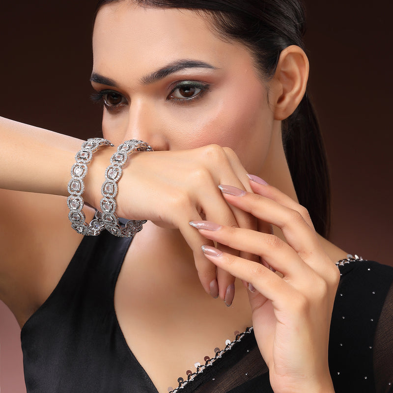 Rhodium Plated Silver Toned Bow Shaped White American Diamond Studded Bangles Set Of 2