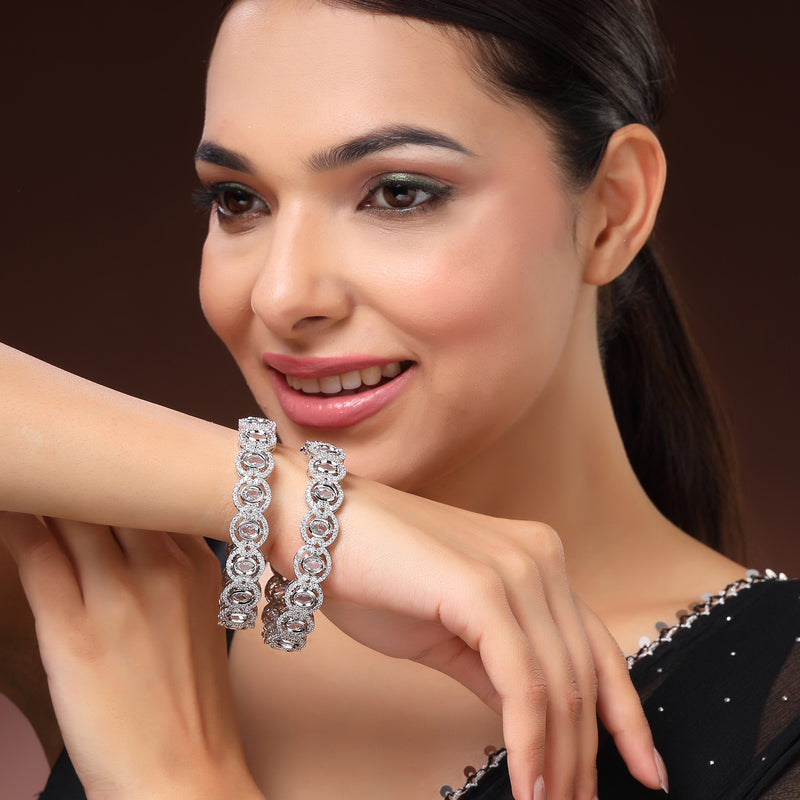 Rhodium Plated Silver Toned Oval Shaped White American Diamond Studded Bangles Set Of 2