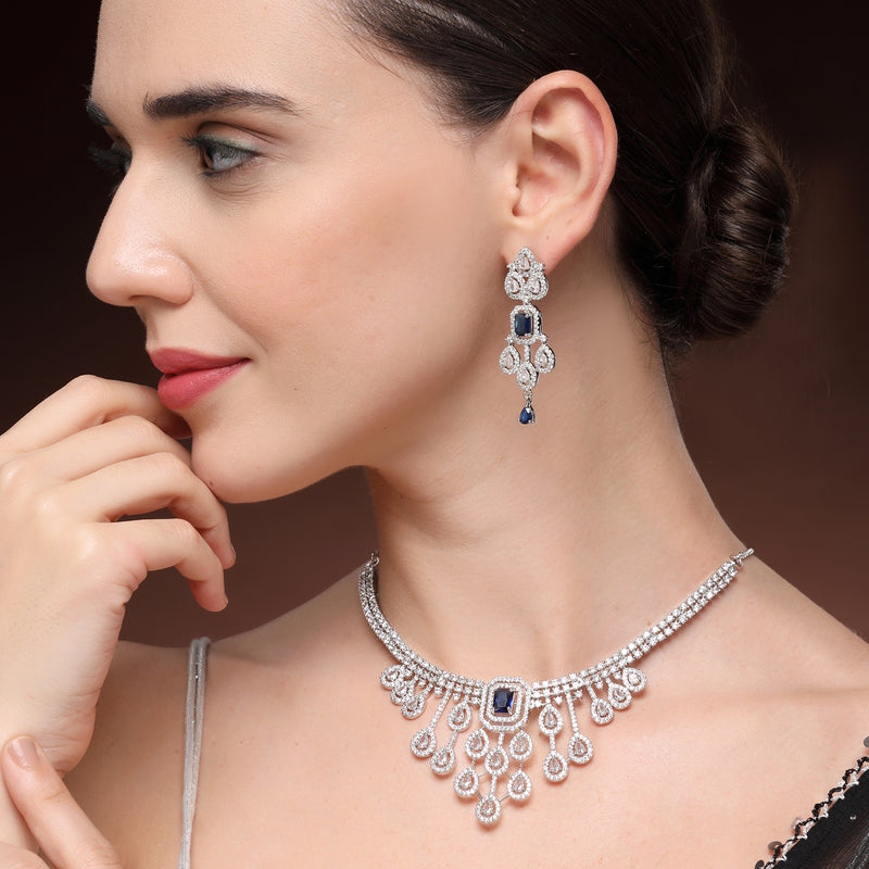 Rhodium Plated Silver Toned Teardrop Shaped Blue & White American Diamond Studded Jewellery Set