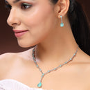 Rhodium Plated Silver Toned Teardrop Shaped Sea Green & White American Diamond Studded Jewellery Set