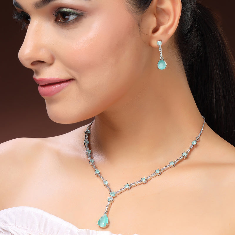 Rhodium Plated Silver Toned Teardrop Shaped Sea Green & White American Diamond Studded Jewellery Set