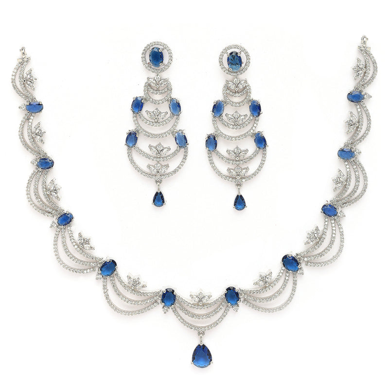 Rhodium Plated Silver Toned Crescent Shaped Blue & White American Diamond Studded Necklace With Earrings Jewellery Set