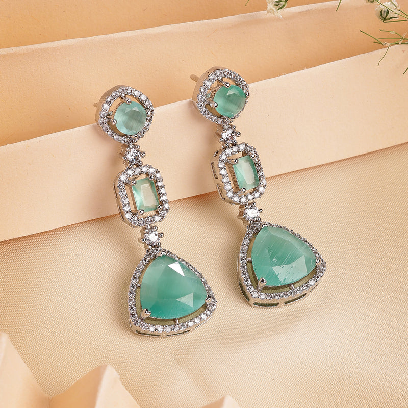 Rhodium Plated Silver Toned Geometric Shaped Sea Green & White American Diamond Studded Drop Earrings