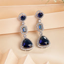 Rhodium Plated Silver Toned Geometric Shaped Navy Blue & White American Diamond Studded Drop Earrings