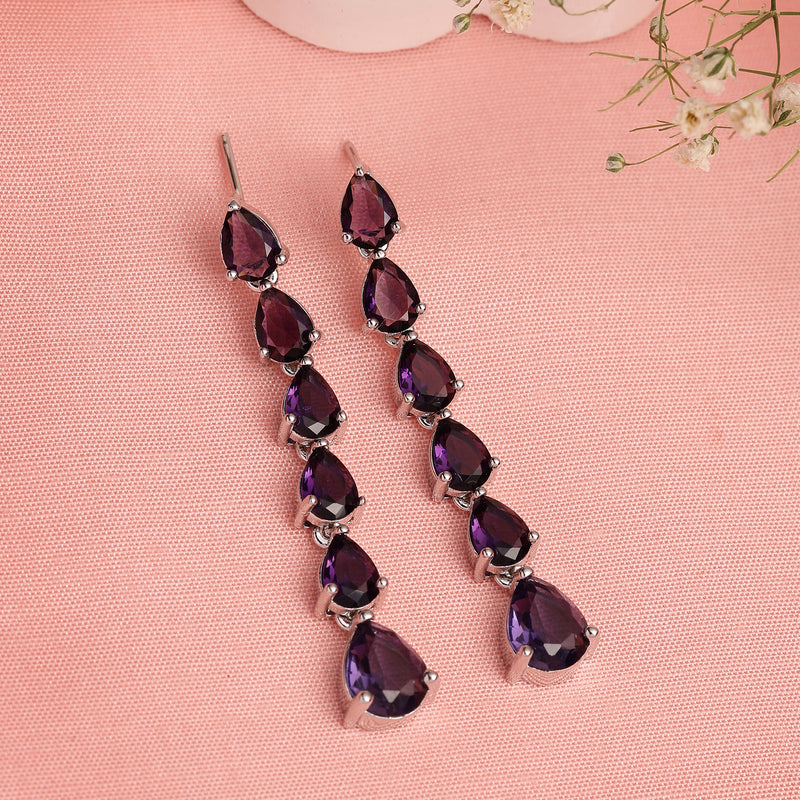 Rhodium Plated Silver Toned Teardrop Shaped Purple American Diamond Studded Linear Dangler Earrings