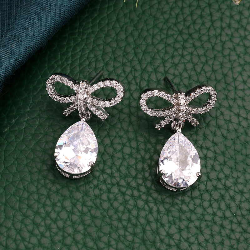 Rhodium Plated Silver Toned Bow Shaped White American Diamond Studded Drop Earrings