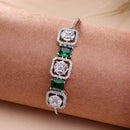 Zeneme Rhodium Plated Silver Toned White Round & Green Rectangle American Diamond Studded  Wraparound Adjustable Bracelet