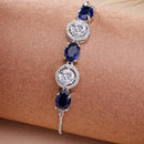 Rhodium Plated Silver Toned White Round & Blue  Oval AD Studded Wraparound Adjustable Bracelet