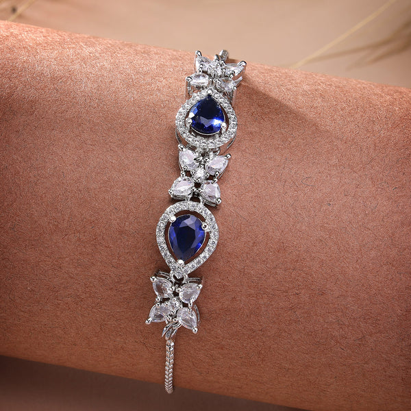 Rhodium Plated Silver Toned White Flower & Blue Teardrop American Diamond Studded Wraparound Adjustable Bracelet