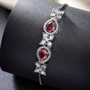 Rhodium Plated Silver Toned White Flower & Red Teardrop AD Studded Wraparound Adjustable Bracelet