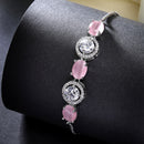 Rhodium Plated Silver Toned White Round & Pink Oval American Diamond Studded Wraparound Adjustable Bracelet