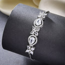 Rhodium Plated Silver Toned White Flower & Teardrop American Diamond Studded Wraparound Adjustable Bracelet