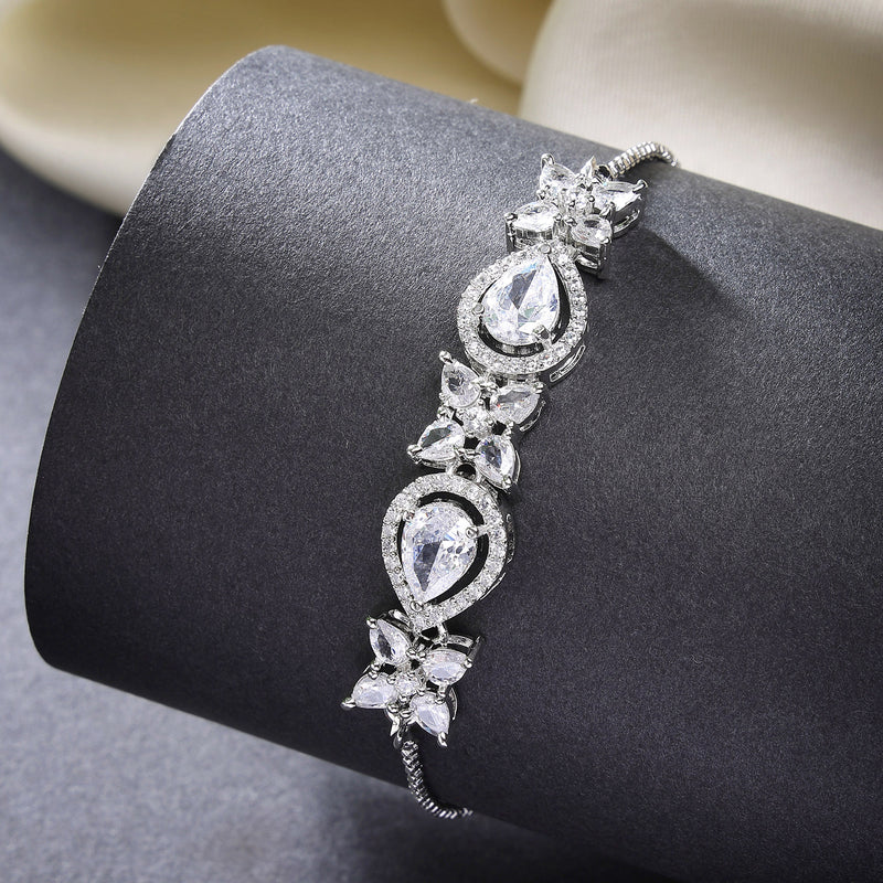 Rhodium Plated Silver Toned White Flower & Teardrop American Diamond Studded Wraparound Adjustable Bracelet