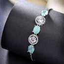 Rhodium Plated Silver Toned White Round & Mint Green Oval AD Studded Wraparound Adjustable Bracelet