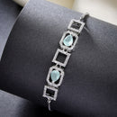 Rhodium Plated Silver Toned White Square Cut Mint Green Teardrop Ad Studded Wraparound Adjustable Bracelet