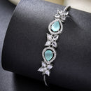 Rhodium Plated Silver Toned White Flower & Mint Green Teardrop American Diamond Studded Wraparound Adjustable Bracelet