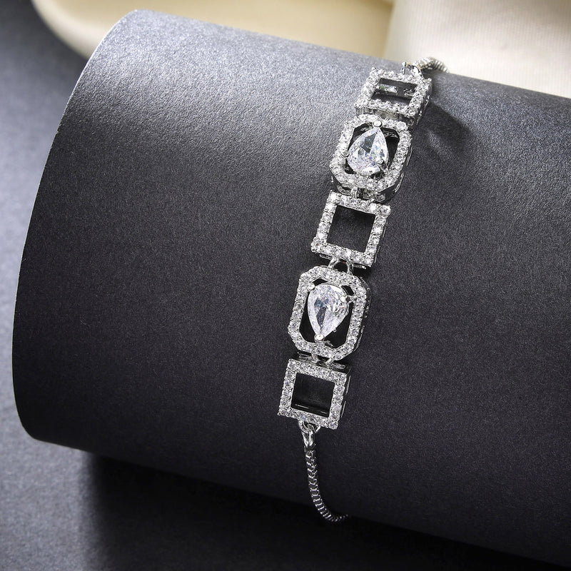 Rhodium Plated Silver Toned White Square Cut & Teardrop American Diamond Studded Wraparound Adjustable Bracelet
