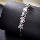 Rhodium Plated Silver Toned White Flower & Pink Teardrop American Diamond Studded  Wraparound Adjustable Bracelet