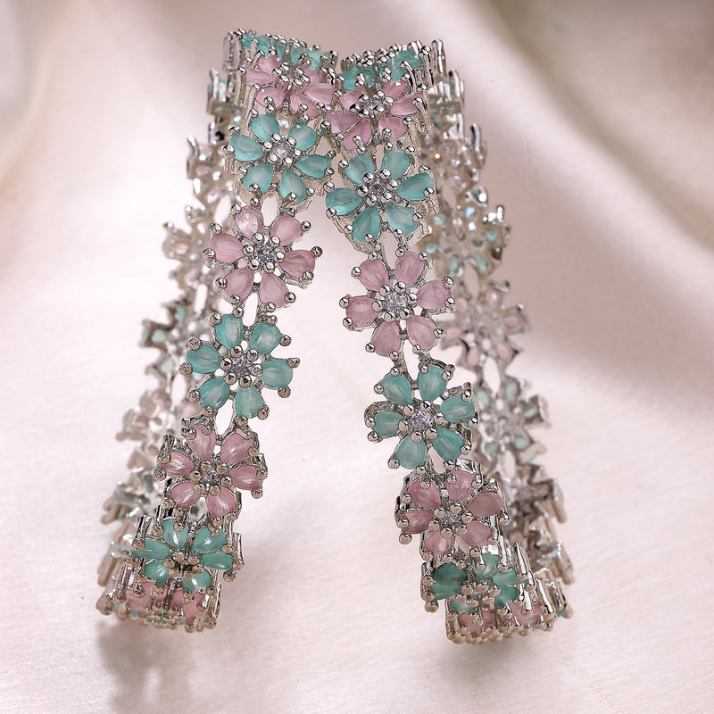 Rhodium Plated Silver Toned Floral Shaped Sea Green & Pink American Diamond Studded Bangles Set Of 2