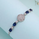 Rhodium Plated Silver Toned White And Blue American Diamond Studded Adjustable Bracelet