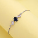 Rhodium Plated Silver Toned Blue And White American Diamond Studded Adjustable Bracelet