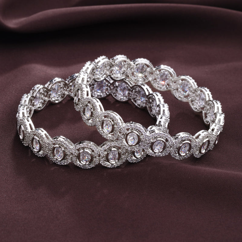 Rhodium Plated Silver Toned Oval Shaped White American Diamond Studded Bangles Set Of 2